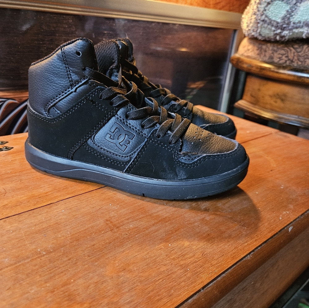 Youth All Black DC tennis shoes
